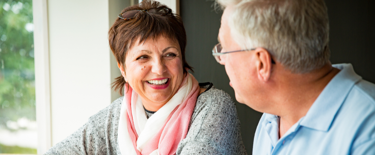 A couple talking over a coffee.