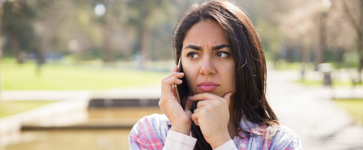 Lady looking concerned about a phone call
