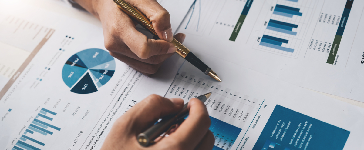 Two people looking at financial documents.