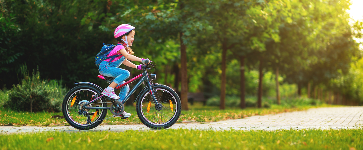 A girl riding a bike.