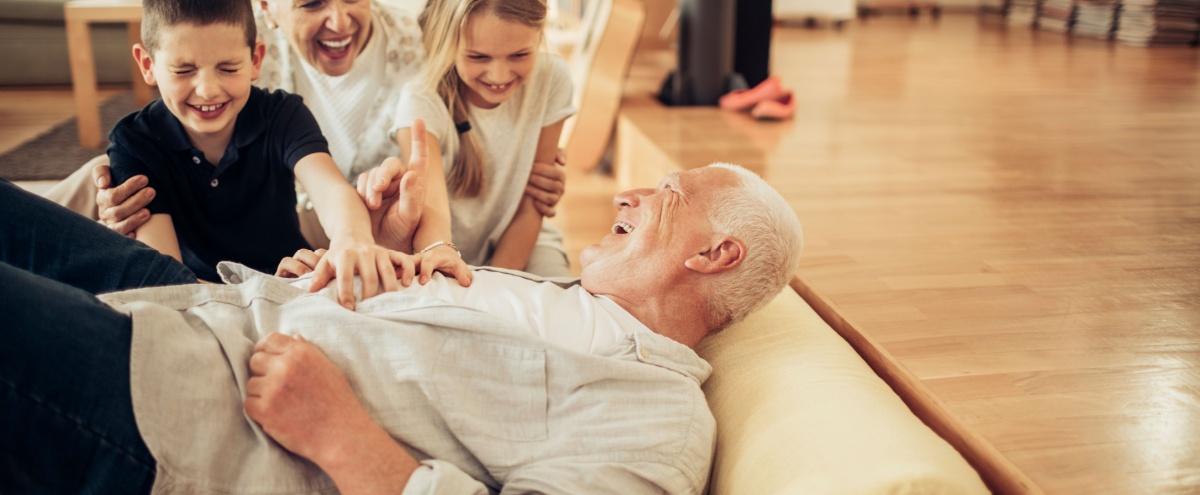 Grandparents playing with their grandchildren.
