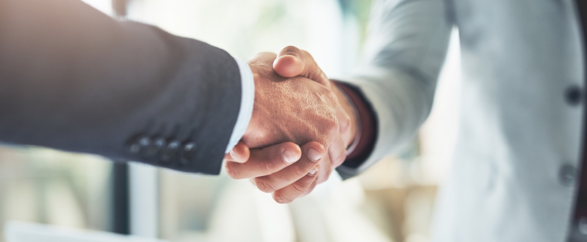 Two people shaking hands.