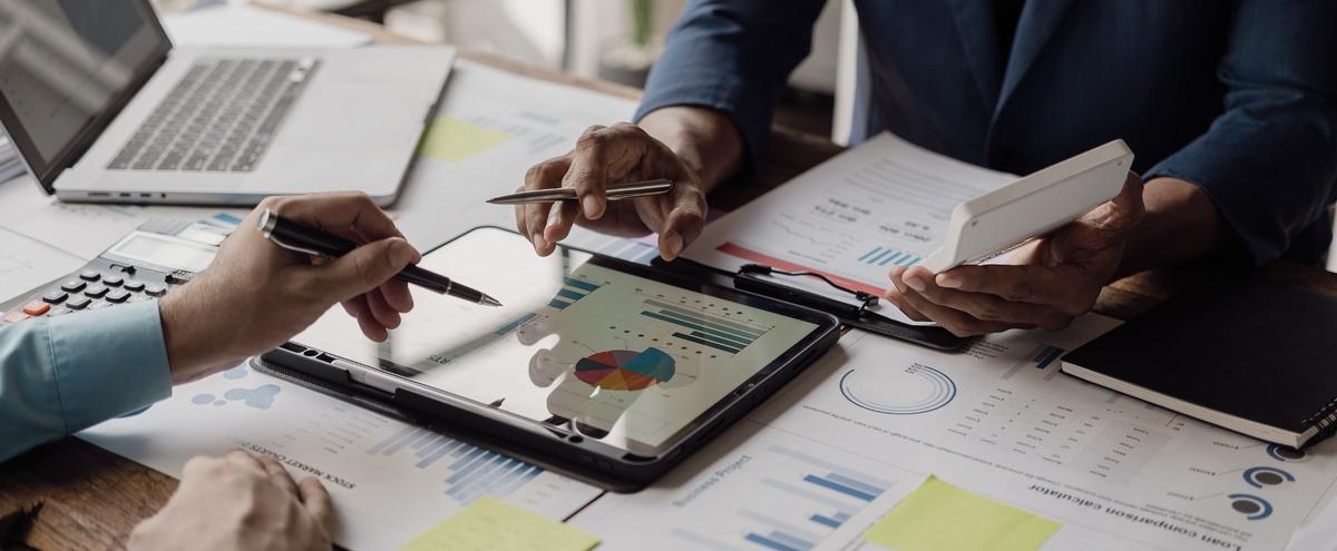 Business people looking at documents in an office.
