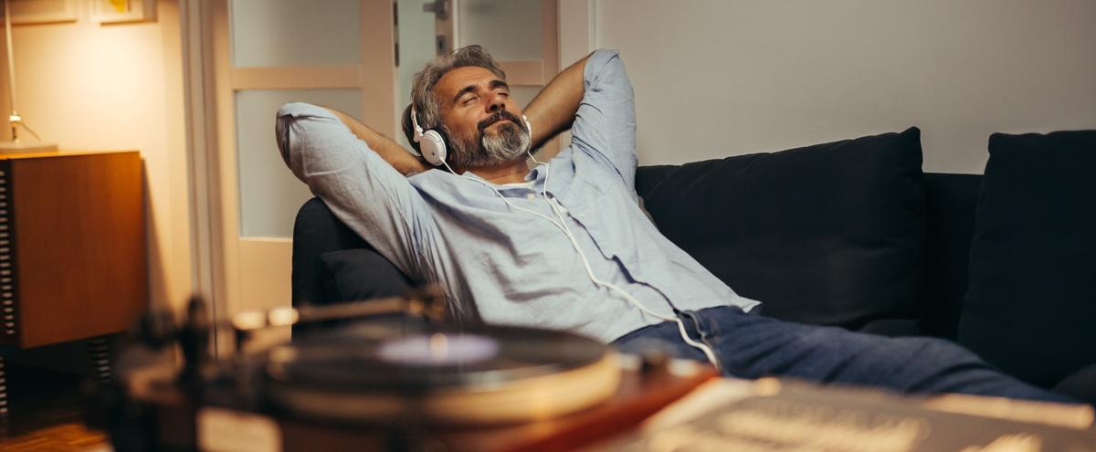 A man relaxing while listening to music.